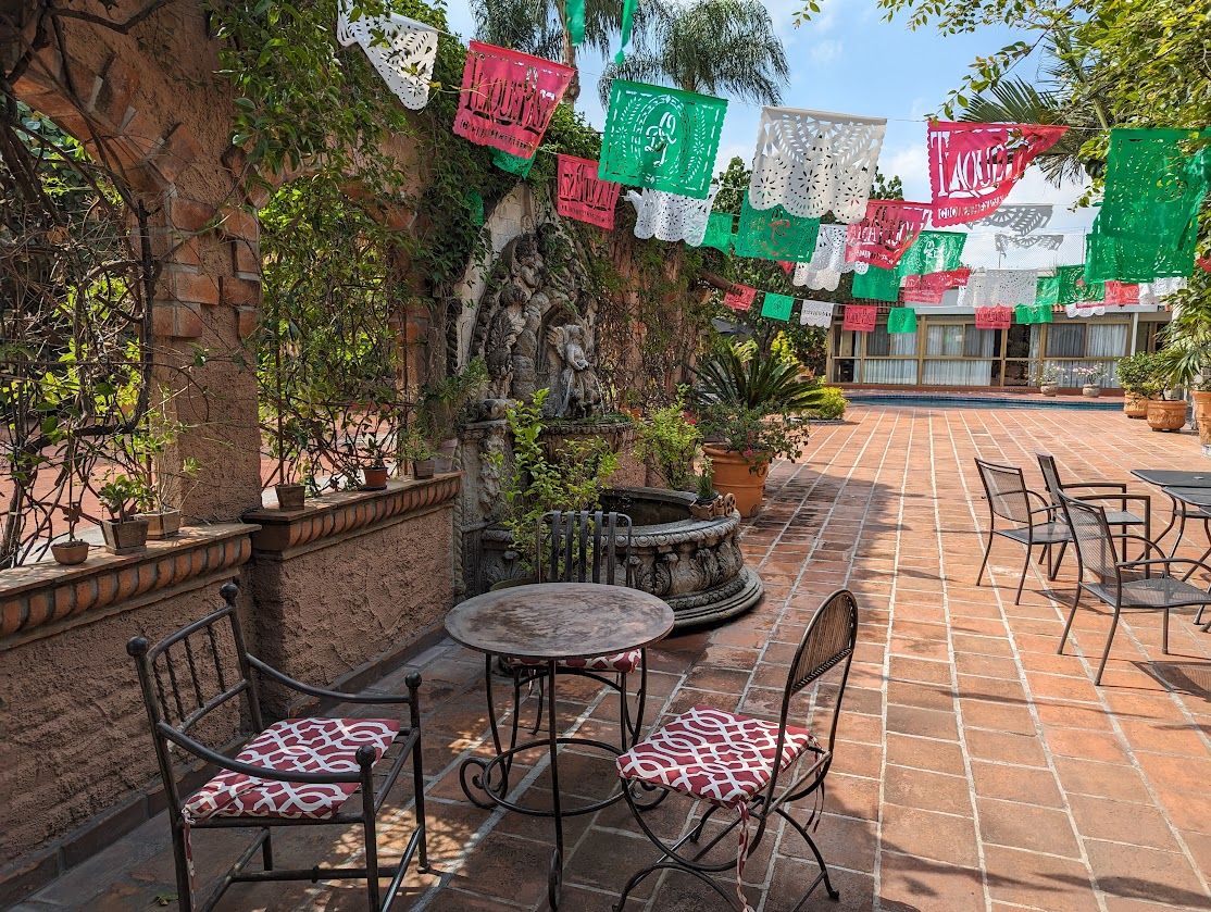 Papel picado over a courtyard fountain in Tlaquepaque