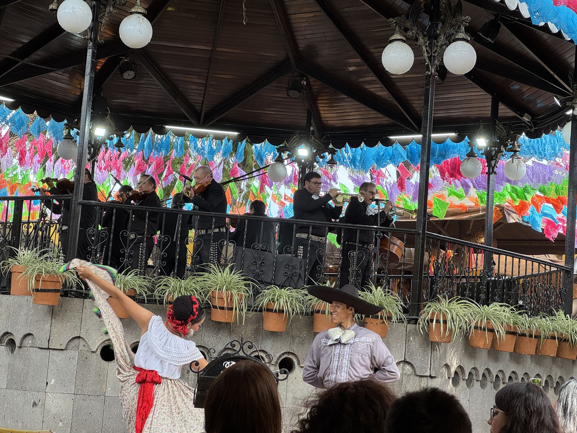 Mariachi and folklórico performance at a gazebo